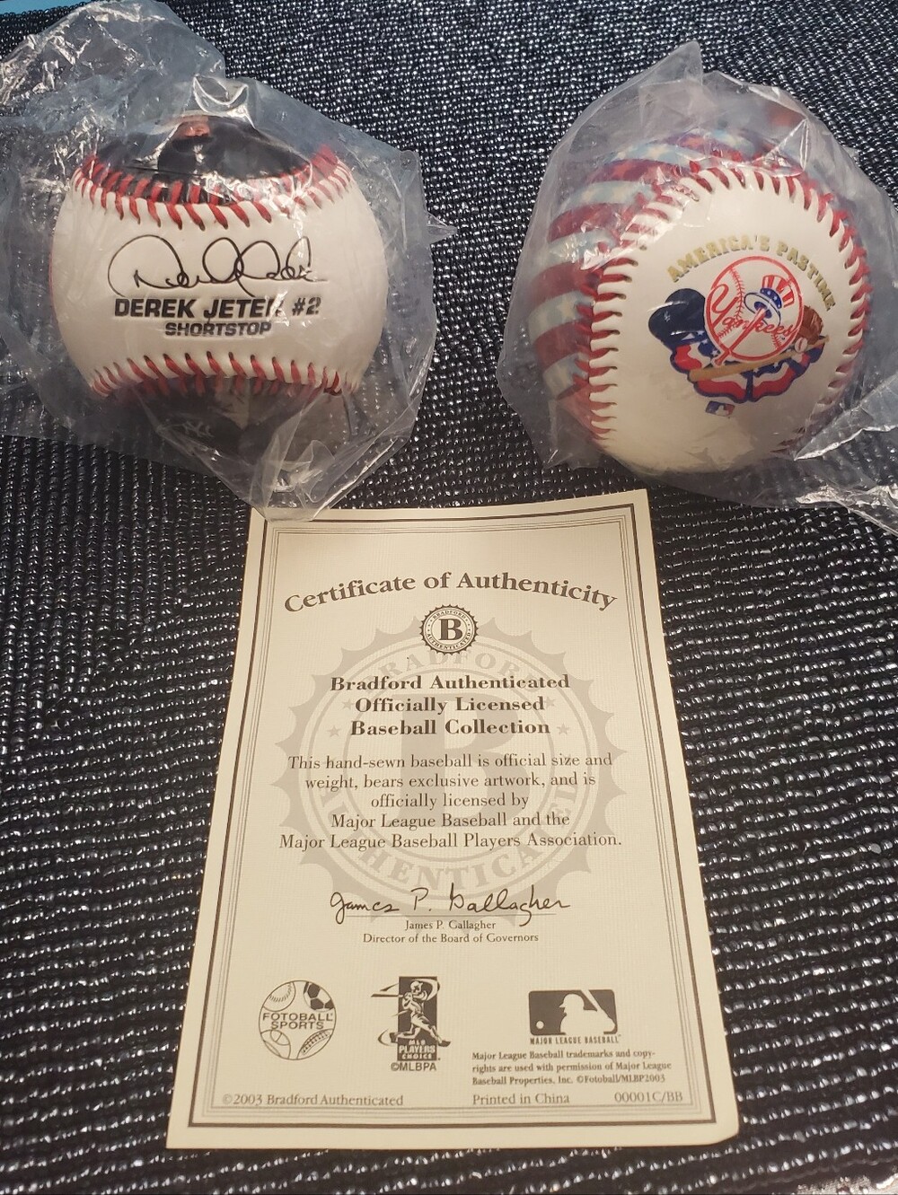 Derek Jeter souvenir display ball & New York Yankees 100th Anniversary Ball